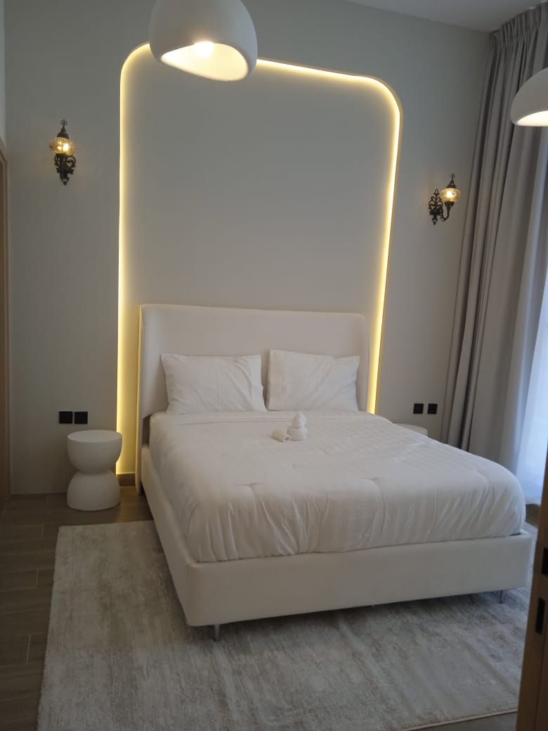 Bedroom wall feature with integrated warm lighting