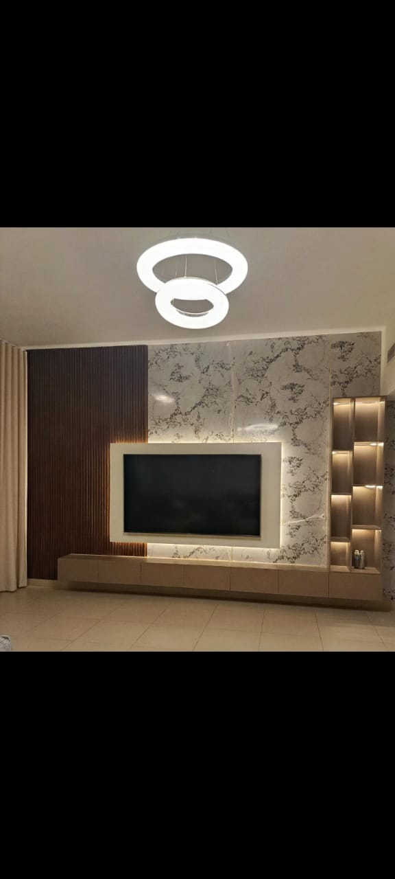 Completed living-room feature wall with modern lighting