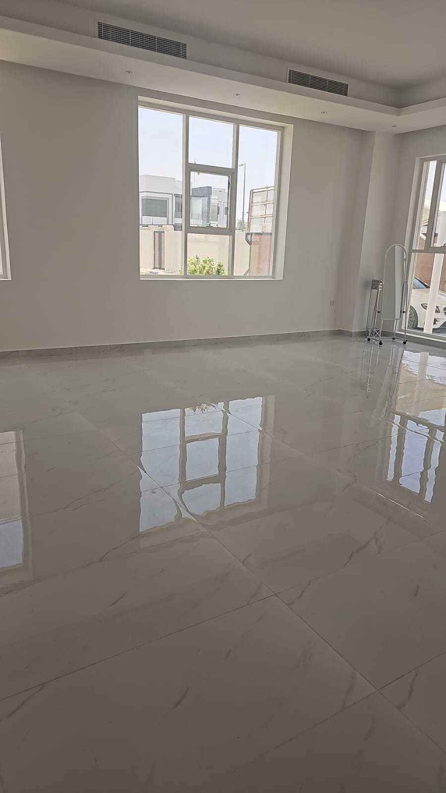 Finished interior floor with polished marble-look tiles