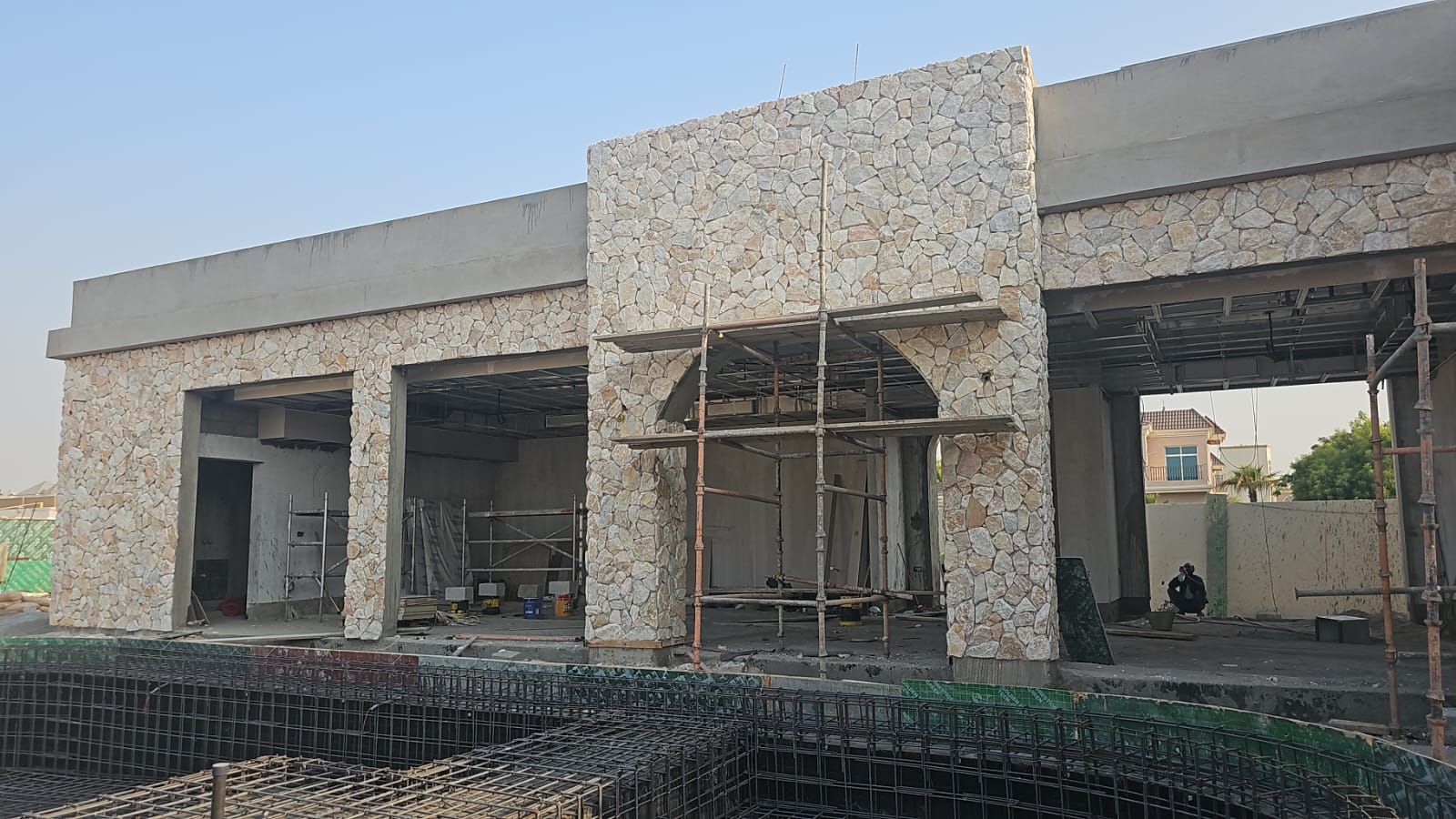 Exterior facade work with natural stone cladding